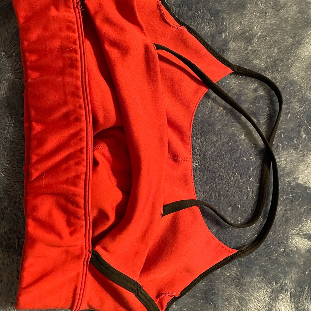 Womens sports bra. No padding. Looks new besides one spot one the front.